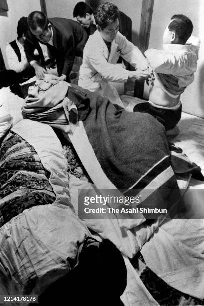 Medical staffs treat officers as the United Red Army members take a hostage at the Asama Sanso lodge on February 25, 1972 in Karuizawa, Nagano, Japan.