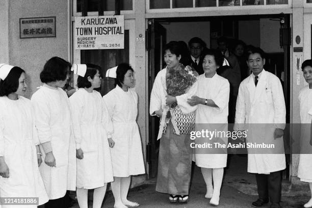 Yasuko Mita, the hostage by the United Red Army at the Asama Sanso lodge, leaves the Karuizawa Hospital on March 14, 1972 in Karuizawa, Nagano, Japan.