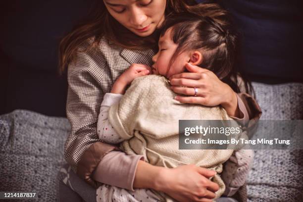 top view of little girl sleeping soundly under mom's arms - chinese family with one child stock pictures, royalty-free photos & images