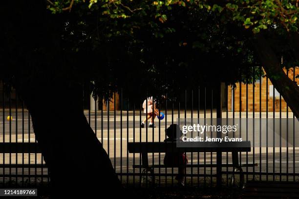 Child is seen in a school yard on March 23, 2020 in Sydney, Australia. From midday Monday, venues such as bars, clubs, nightclubs, cinemas, gyms and...