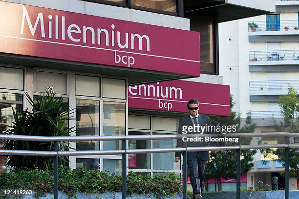 Pedestrian passes the headquarters of Millenium BCP Investimento, owned by Banco Comercial Portugues SA, in Lisbon, Portugal, on Friday, Aug. 19,...