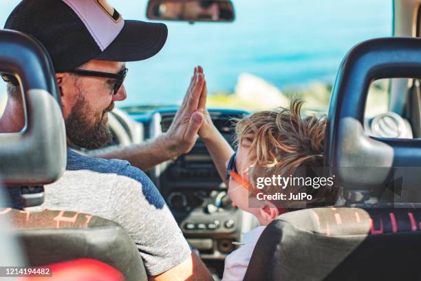 road trip. father and son travelling together by car - hipster fun stock pictures, royalty-free photos & images