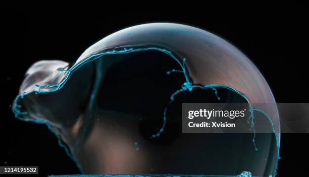 soap bubble broken moment shot by high speed sync. - freeze motion stock-fotos und bilder