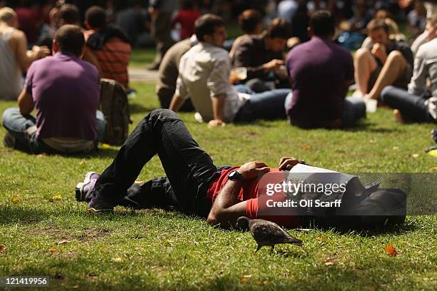 Man relaxes in Soho Square on August 19, 2011 in London, England. Members of the public enjoyed the sunny summer weather in the Southbank Centre'...