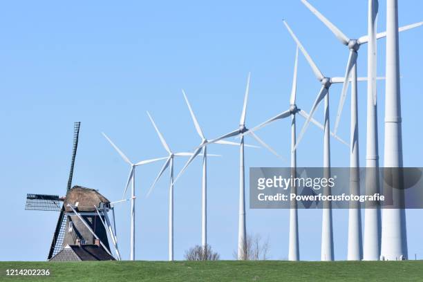 old and new - dutch windmill bildbanksfoton och bilder