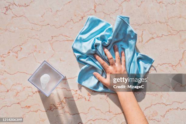 cleaning marble surface by using liquid soap - straccio foto e immagini stock
