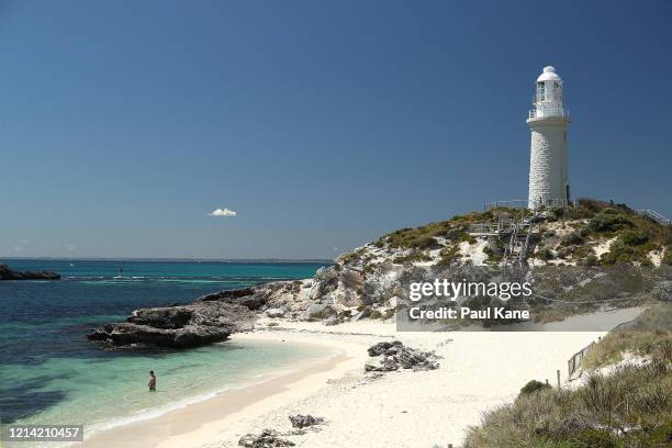 Lone swimmer is is seen at Pinky Beach on March 23, 2020 in Rottnest Island, Australia. The West Australian state government announced Rottnest...