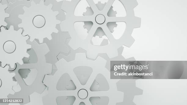 engranajes sobre fondo blanco, concepto mínimo de trabajo en equipo - cambio de marchas fotografías e imágenes de stock