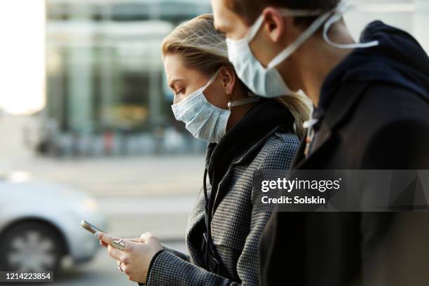 two young persons - climate change health stock pictures, royalty-free photos & images