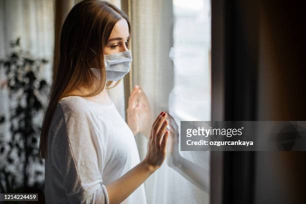 woman in isolation at home for virus outbreak - quarantine stock pictures, royalty-free photos & images