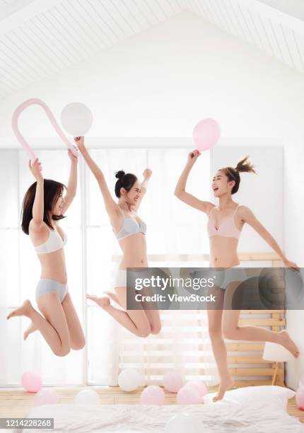 friends play in the bedroom - seize the day bed private view stock pictures, royalty-free photos & images