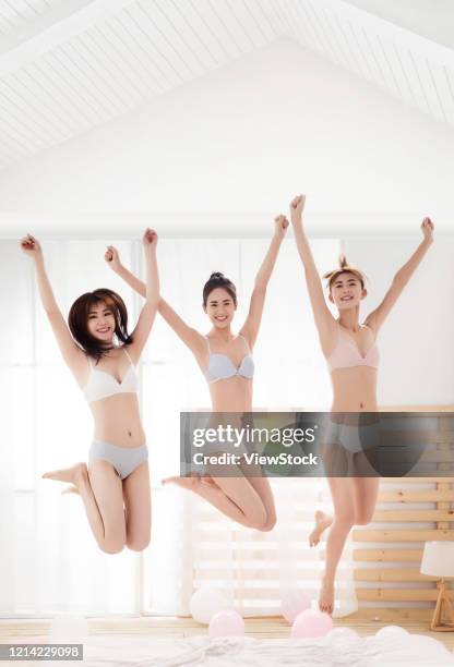 girlfriends bed in the bedroom play jumping - seize the day bed private view stock pictures, royalty-free photos & images