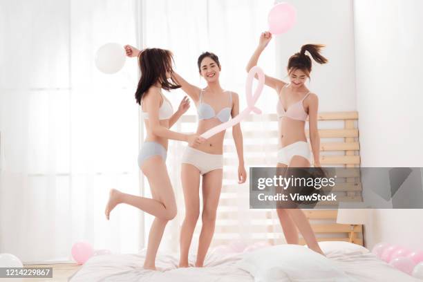 girlfriends bed in the bedroom play jumping - seize the day bed private view stock pictures, royalty-free photos & images