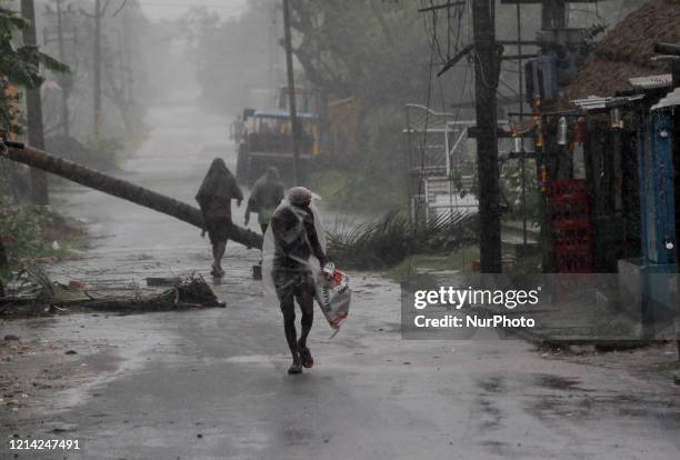 People are seen at the Chandabali and Dhamra area of Bhadrak district, 160 km away from the eastern Indian state Odisha's capital city as the Cyclone...