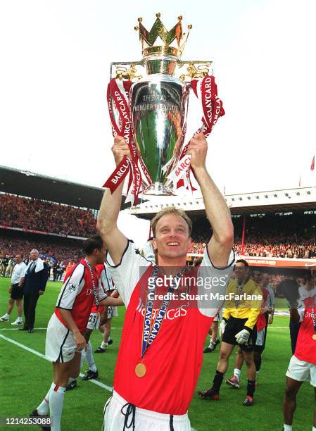 Dennis Bergkamp of Arsenal with the Premier League Trophy after the Premier League match between Arsenal and Everton on May 11, 2002 in London,...