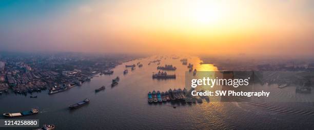 drone photo of cargo ships at chittagong port, chittagong, bangladesh - bangladesh business stock pictures, royalty-free photos & images