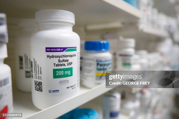 Hydroxychloroquine sits on a shelf at Rock Canyon Pharmacy in Provo, Utah, on May 20, 2020. - US President Donald Trump announced May 18 he has been...