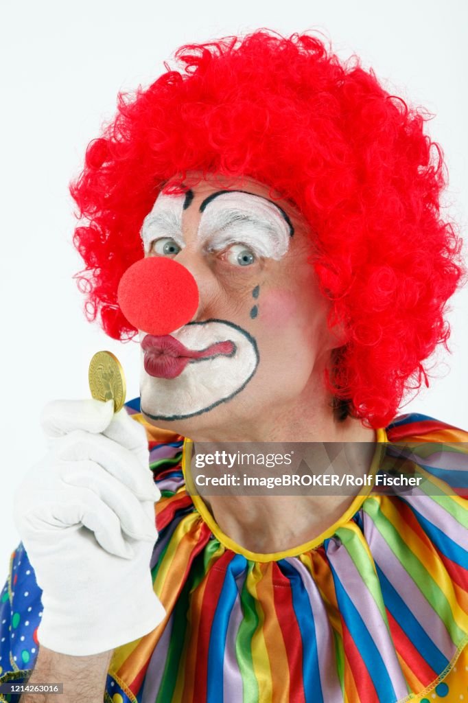 Clown Kisses Gold Coin Germany High Res Stock Photo Getty Images clown-kisses-gold-coin-germany-high-res-stock-photo-getty-images