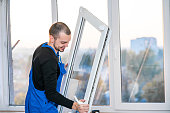 Professional master at repair and installation of windows, at work