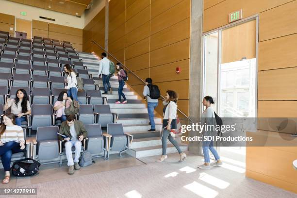 students entering college lecture hall - auditorium door stock pictures, royalty-free photos & images