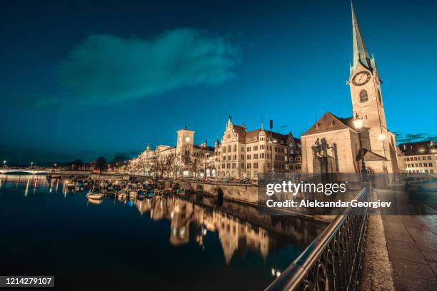 fraumunster church at night in zurich, switzerland - zurich switzerland stock pictures, royalty-free photos & images