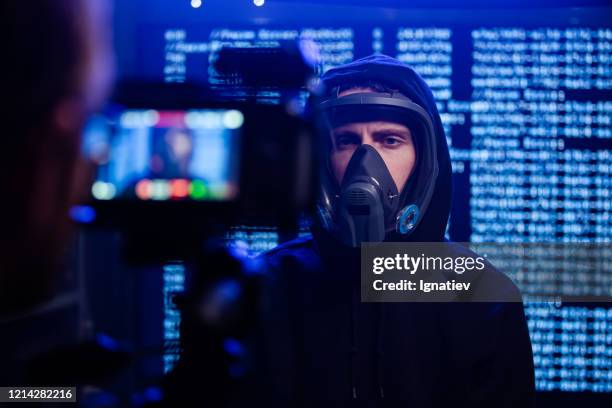 a backstage of shooting of man in the gas mask - backstage tv stock pictures, royalty-free photos & images