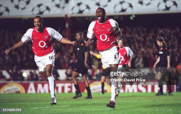 Patrick Vieira of Arsenal celebrates after scoring the first goal with Thierry Henry during the UEFA Champions League Phase 2 Group B match between...