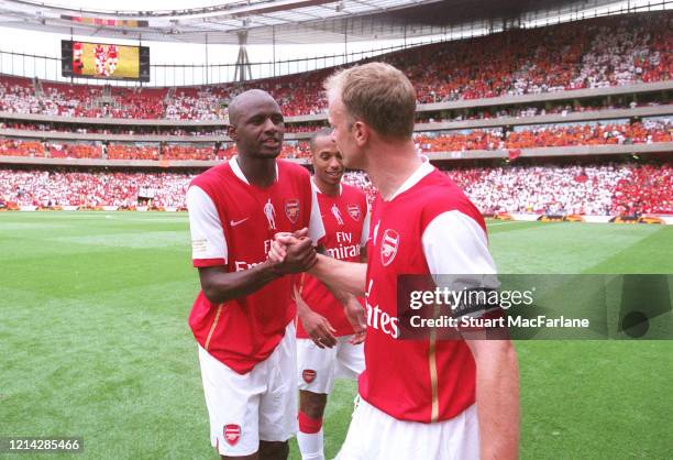 Patrick Vieira ex Arsenal shakes hands with Dennis Bergkamp ex Arsenal after the Dennis Bergkamp Testimonial between Arsenal XI and Ajax XI on July...