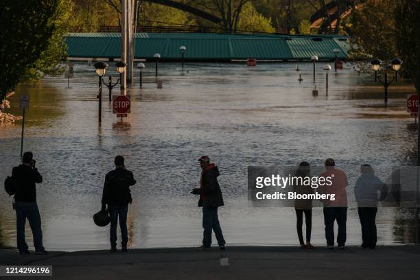 People look at flood waters from the Tittabawassee River in Midland, Michigan, U.S., on Wednesday, May 20, 2020. President Donald Trump said he's...