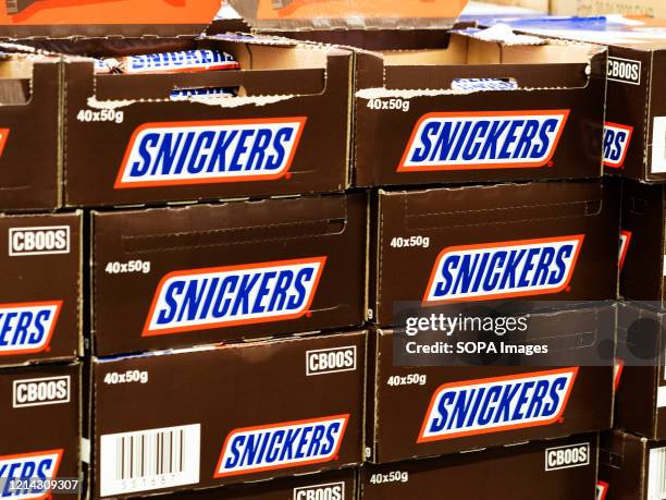 Boxes of Snickers Chocolate Bars seen displayed on a supermarket store.