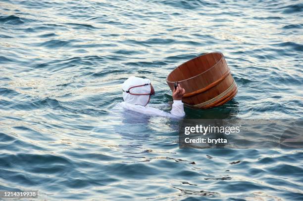 ama diver with floating basket, ise bay, japan - pearl stock pictures, royalty-free photos & images