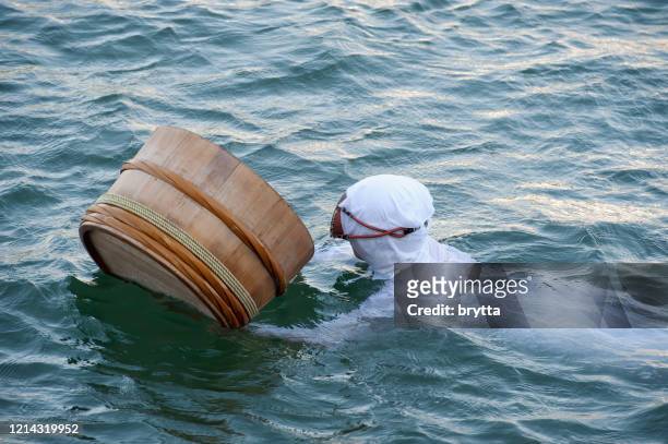 ama diver with floating basket, ise bay, japan - pearl stock pictures, royalty-free photos & images