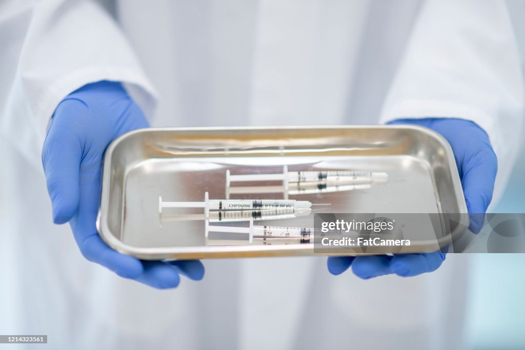 Tray of Medical Syringes stock photo