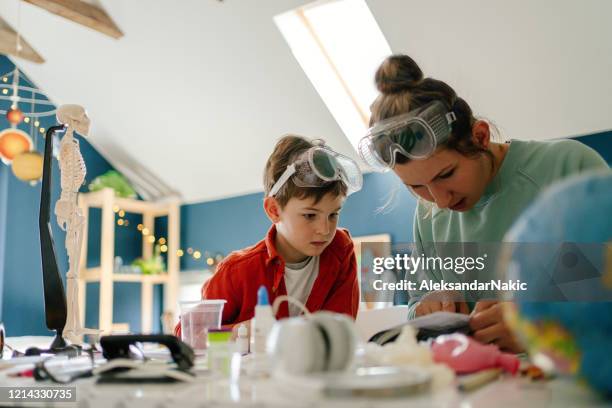 science project with mom - safety glasses at home stock pictures, royalty-free photos & images