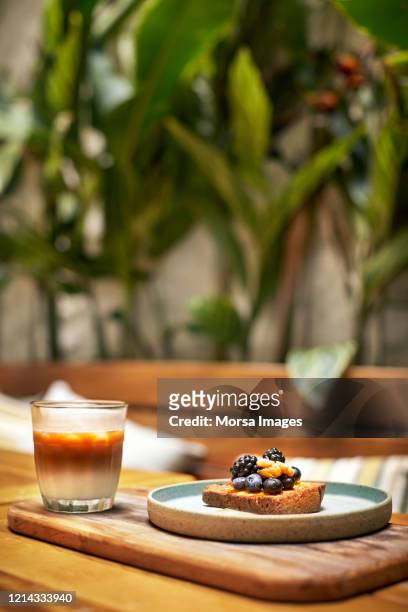 close-up of breakfast in plate by drink on table - rusk stock pictures, royalty-free photos & images