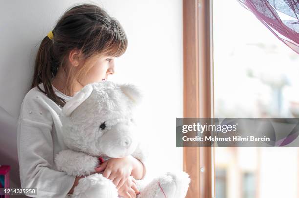 cute girls boring at home with her teddy bear - child abuse stock pictures, royalty-free photos & images