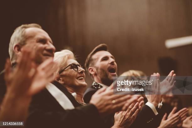 standing ovation in the theater - clapping stock pictures, royalty-free photos & images