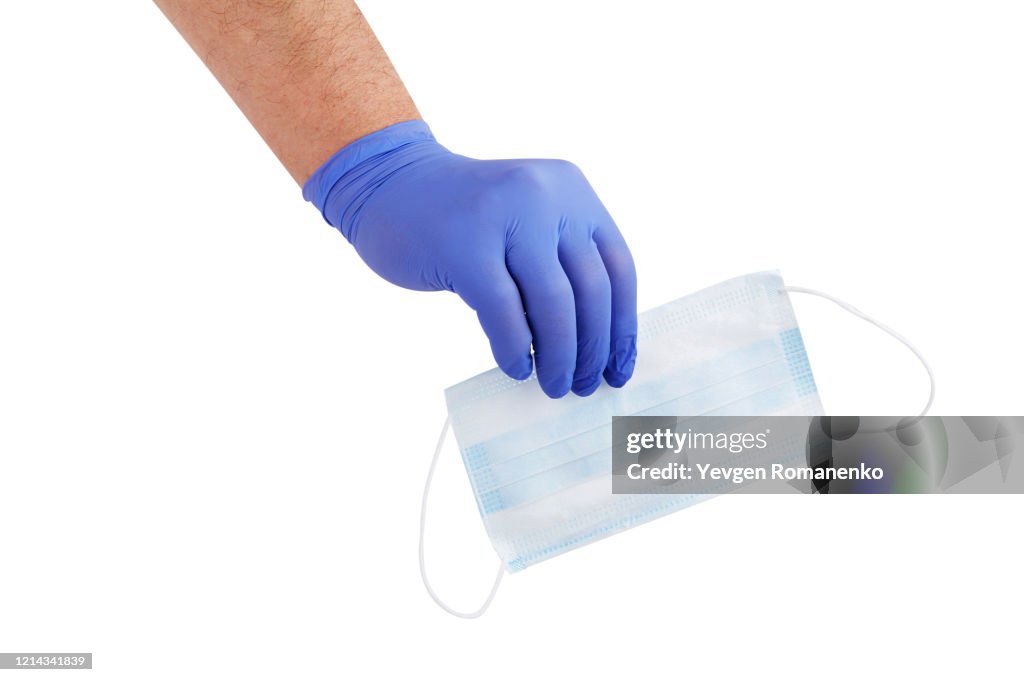 Medical Protection Hand Doctors Hand In A Medical Glove Holding Medical Mask Isolated On A ...