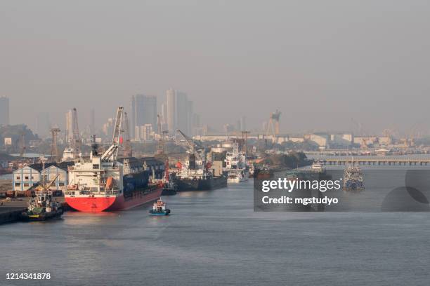 industrial cranes at sea port mumbai. - mumbai india stock pictures, royalty-free photos & images