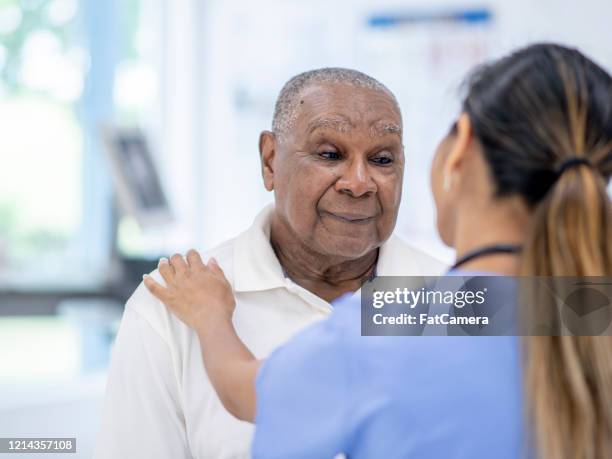 äldre man besök läkare lager foto - african american man depressed bildbanksfoton och bilder