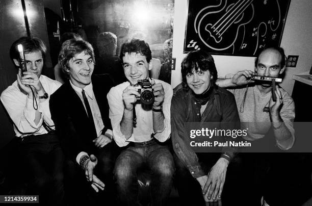 Portrait of English New Wave musician Bruce Woolley and his band, Camera Club, as they pose backstage at the Park West, Chicago, Illinois, March 2,...