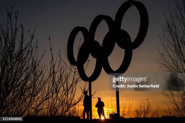 The Olympic rings are seen as sunset in the Olympic Park in Stratford as Tokyo Olympics organisers are considering options to delay the Olympics with...