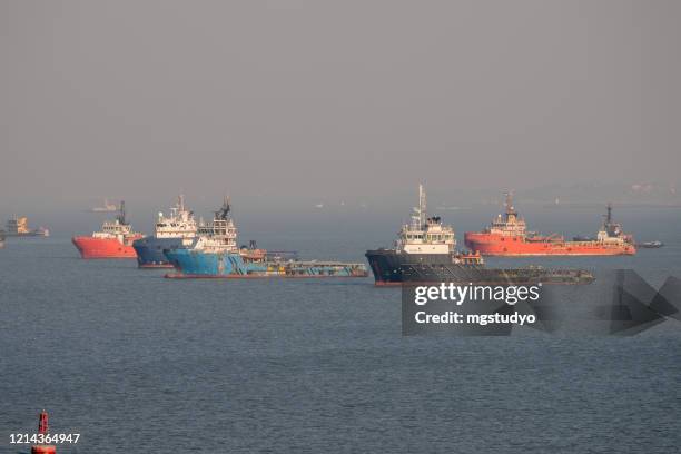 commercial shipping moored off mumbai - oil tanker ship stock pictures, royalty-free photos & images