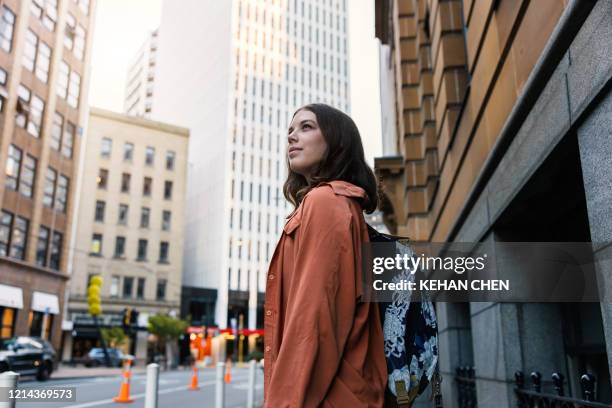 young female tourist travel explore city in wellington new zealand - city sidewalk stock pictures, royalty-free photos & images