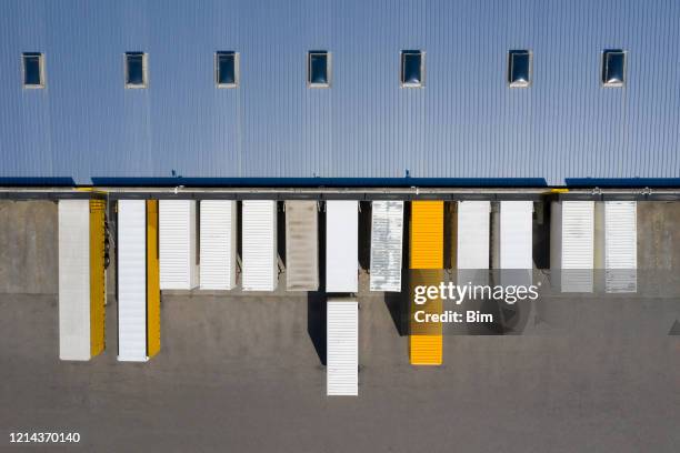 aerial view of cargo containers and distribution warehouse - industrial district stock pictures, royalty-free photos & images