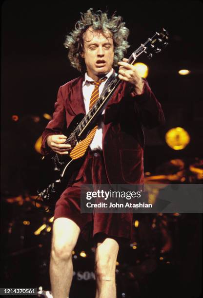 Guitarist Angus Young is shown performing on stage during a live concert appearance with Ac Dc on November 4, 1990.