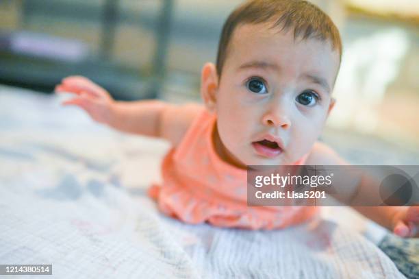 tummy time and infant baby girl - the first time stock pictures, royalty-free photos & images