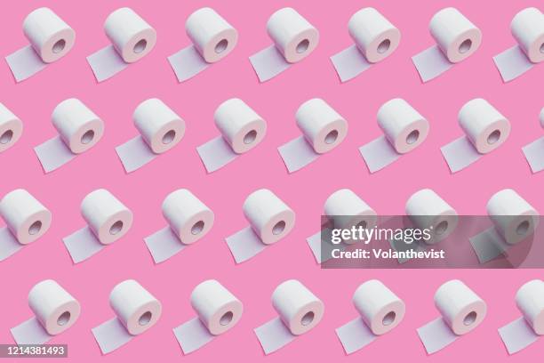 white toilet paper pattern on pink background - paper product stockfoto's en -beelden