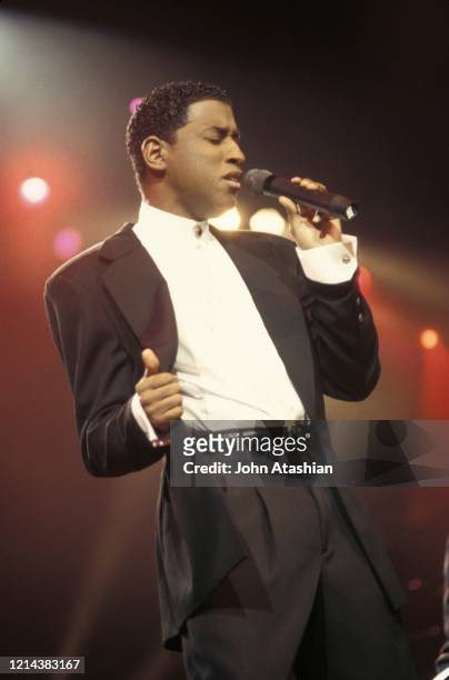 Singer Kenneth Edmonds, better known by his stage name Babyface, is shown performing on stage during a live concert appearance on January 18, 1995.