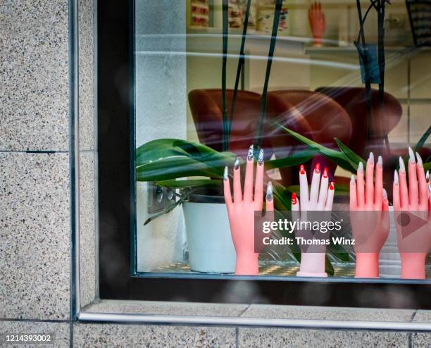 window display of a nail salon - nail salon stock pictures, royalty-free photos & images